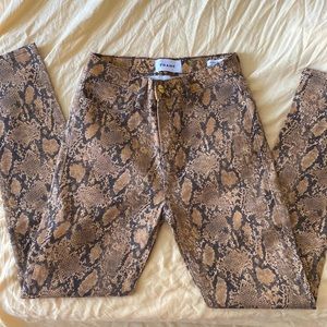 FRAME high-rise snake-effect jeans inspired by the concept of dressed-up casual